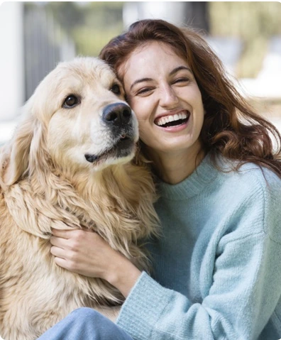 A happy golden retriever with its owner
